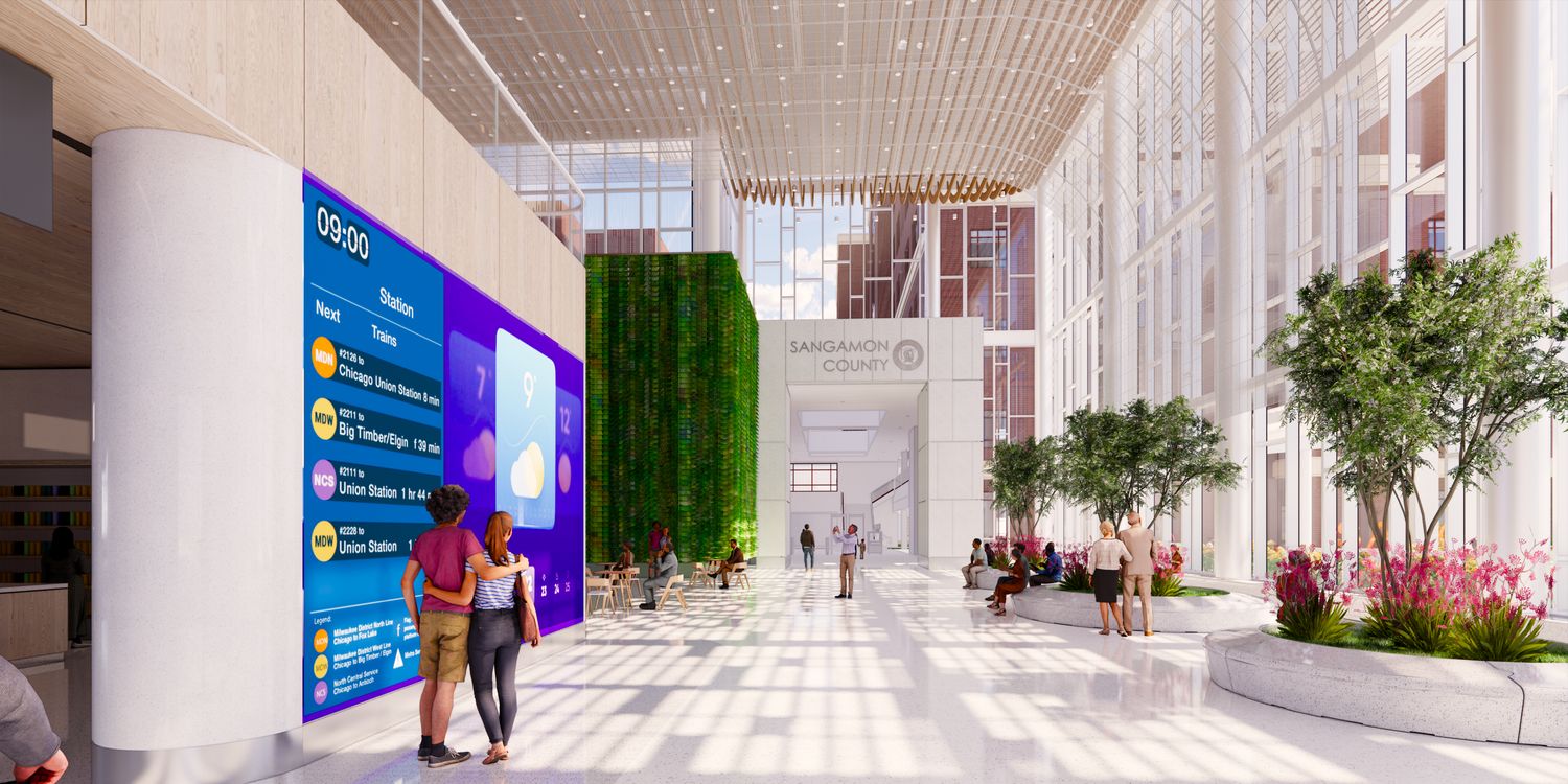 Springfield Transportation Hub atrium with digital transit displays and living wall